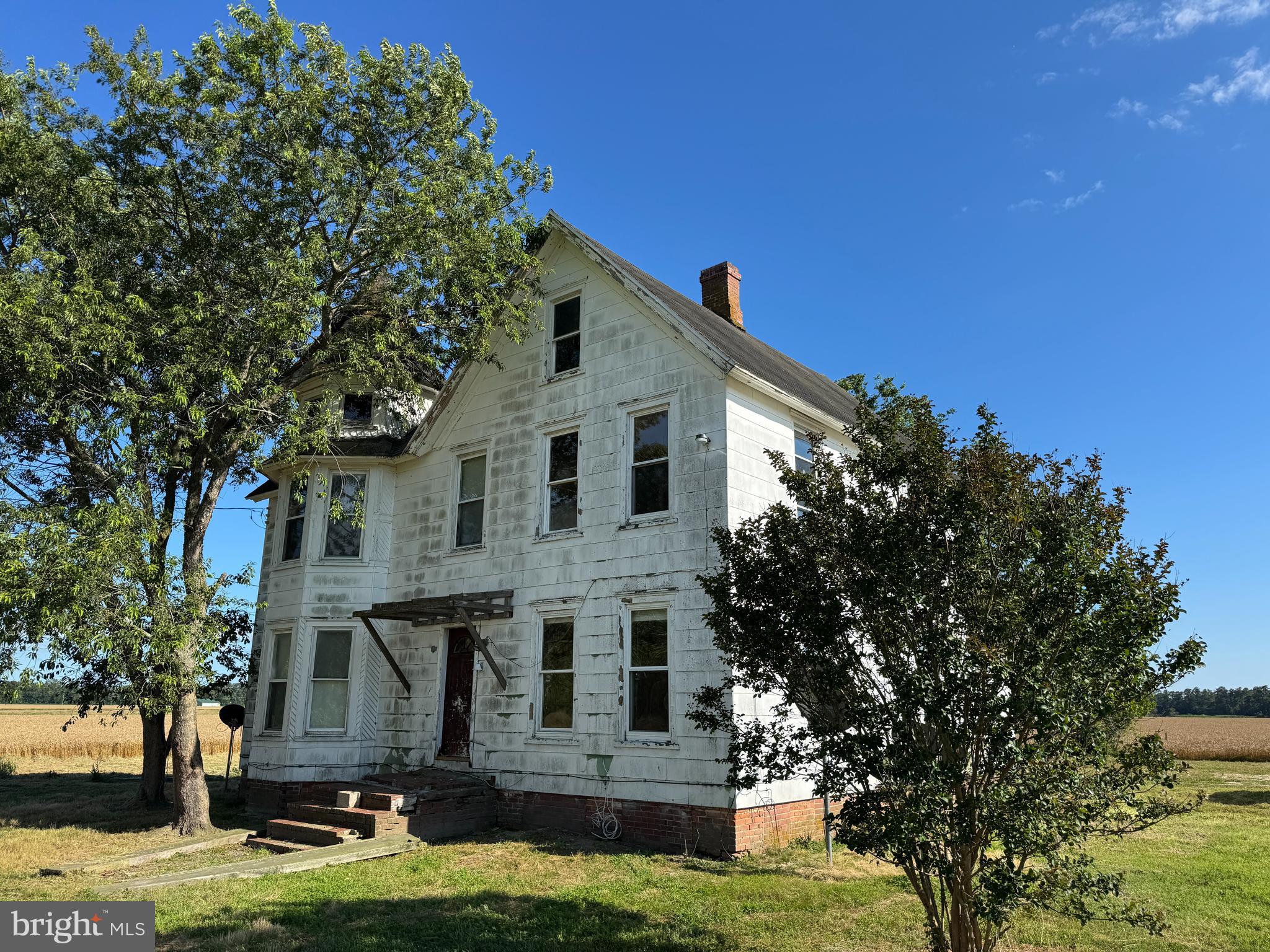 7382 Bullbegger Road Oak Hall, VA 23416 - Photo 2 of 18 a front view of a house with a garden