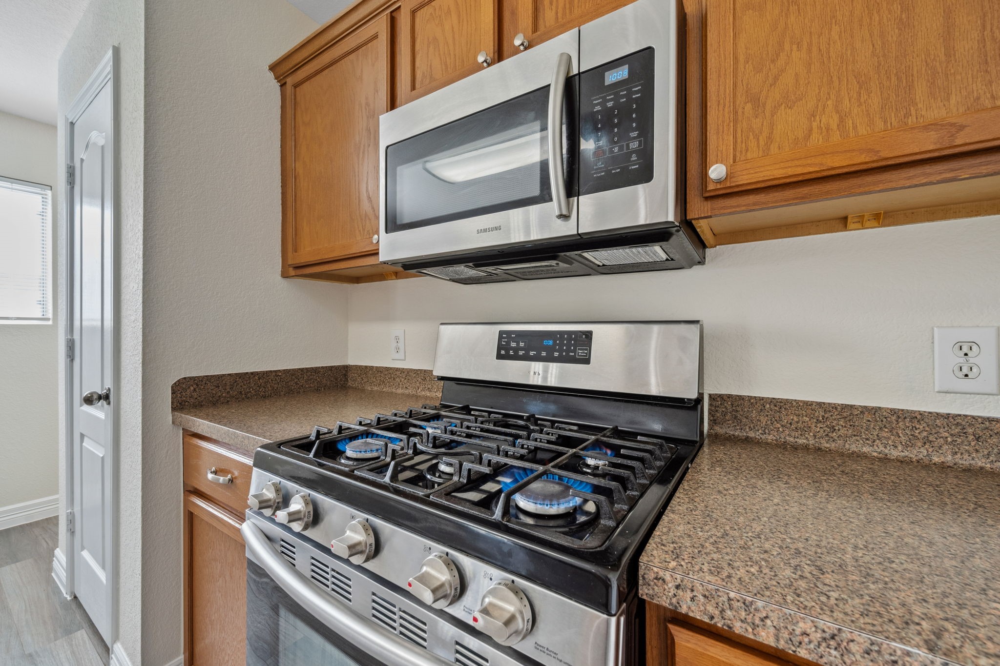 12819 Blue Timbers Court Houston, TX 77044 - Photo 12 of 26 a stove top oven sitting inside of a kitchen