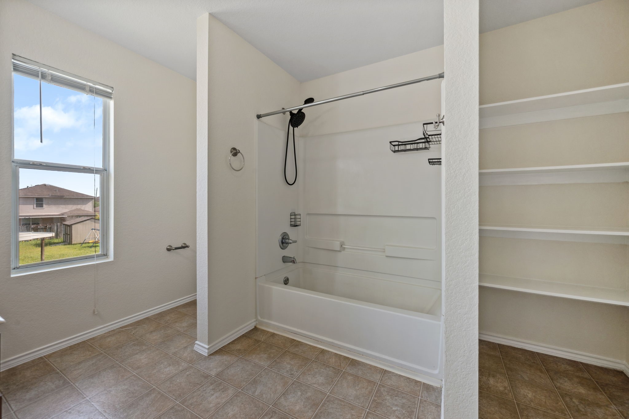 12819 Blue Timbers Court Houston, TX 77044 - Photo 17 of 26 a bathroom with a bathtub