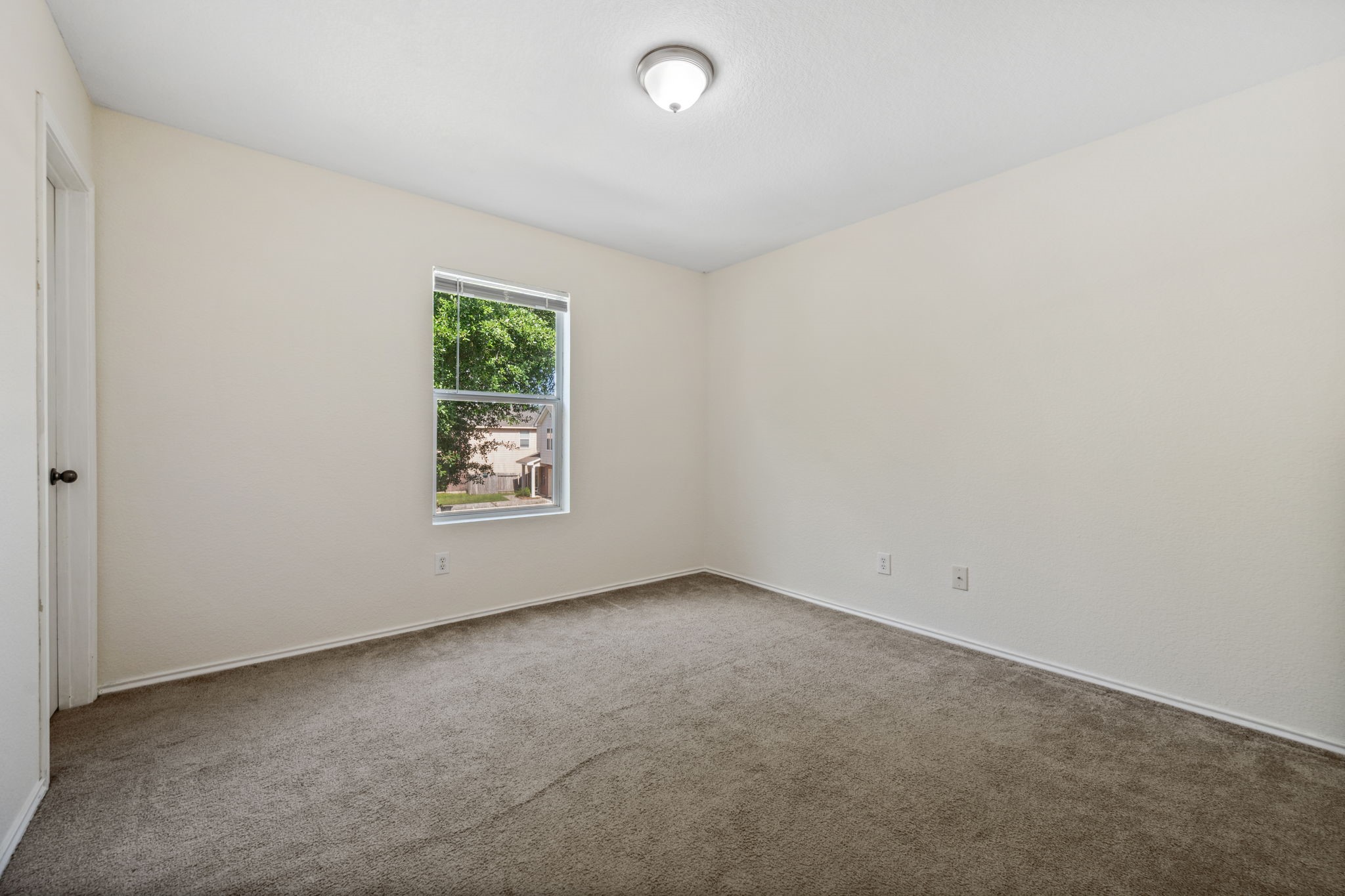 12819 Blue Timbers Court Houston, TX 77044 - Photo 20 of 26 an empty room with a window