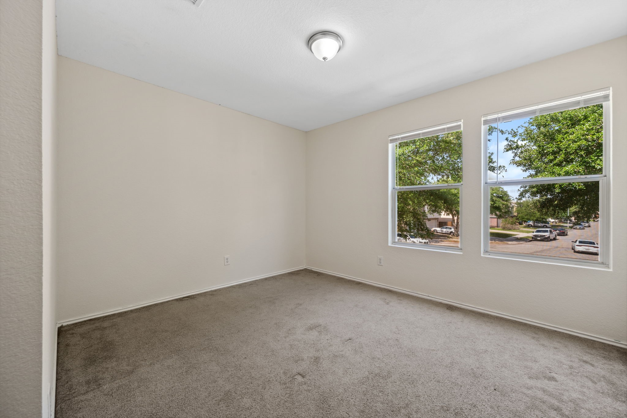 12819 Blue Timbers Court Houston, TX 77044 - Photo 21 of 26 an empty room with windows