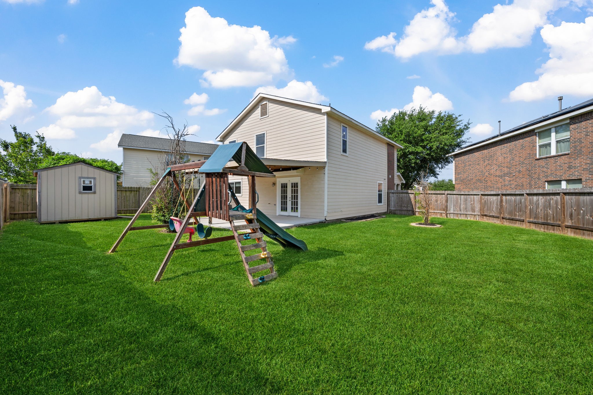 12819 Blue Timbers Court Houston, TX 77044 - Photo 5 of 26 a house with green field in front of it