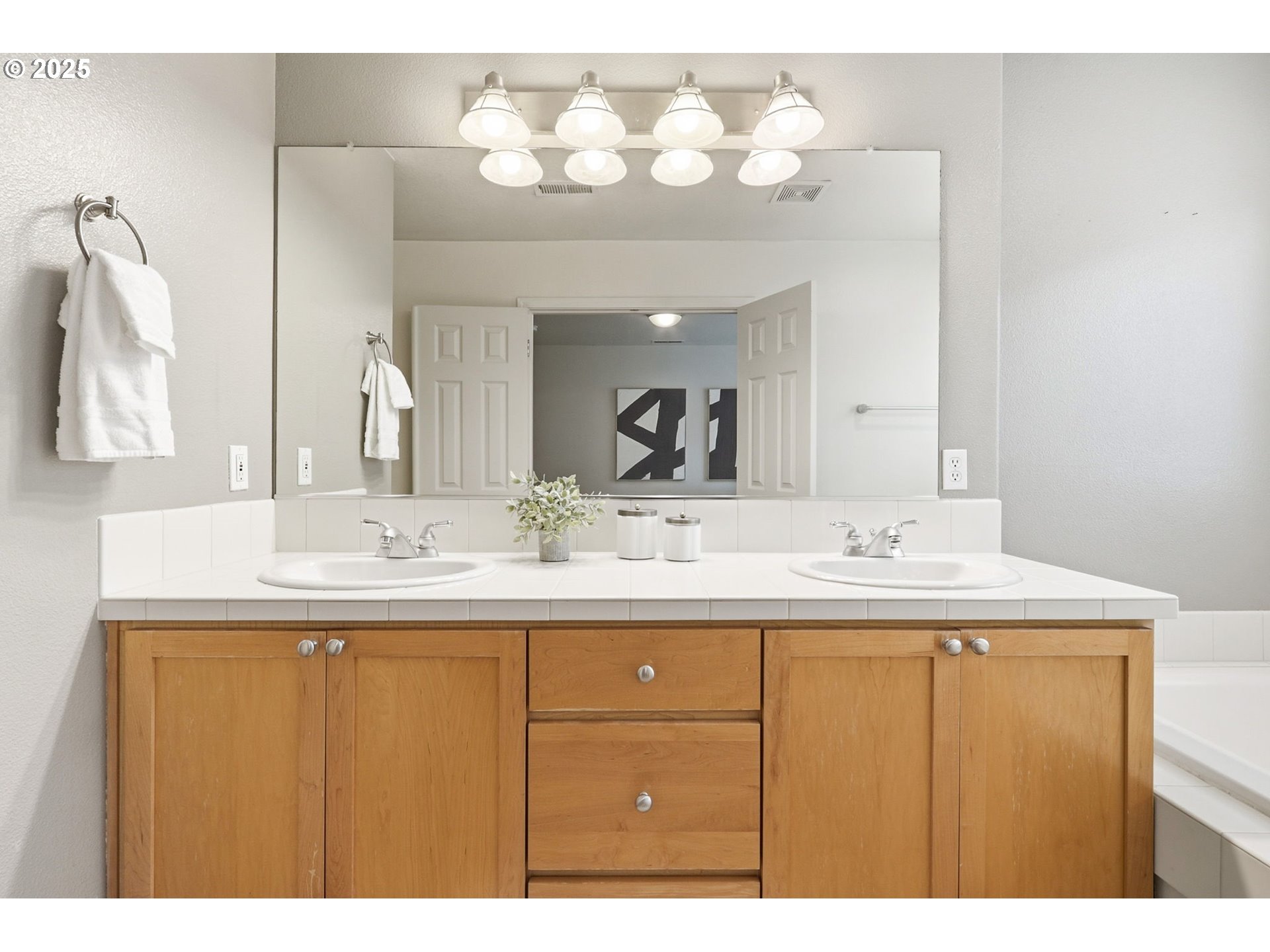 1706 Southwest 172nd Terrace Beaverton, OR 97003 - Photo 21 of 45 a bathroom with a sink and a mirror