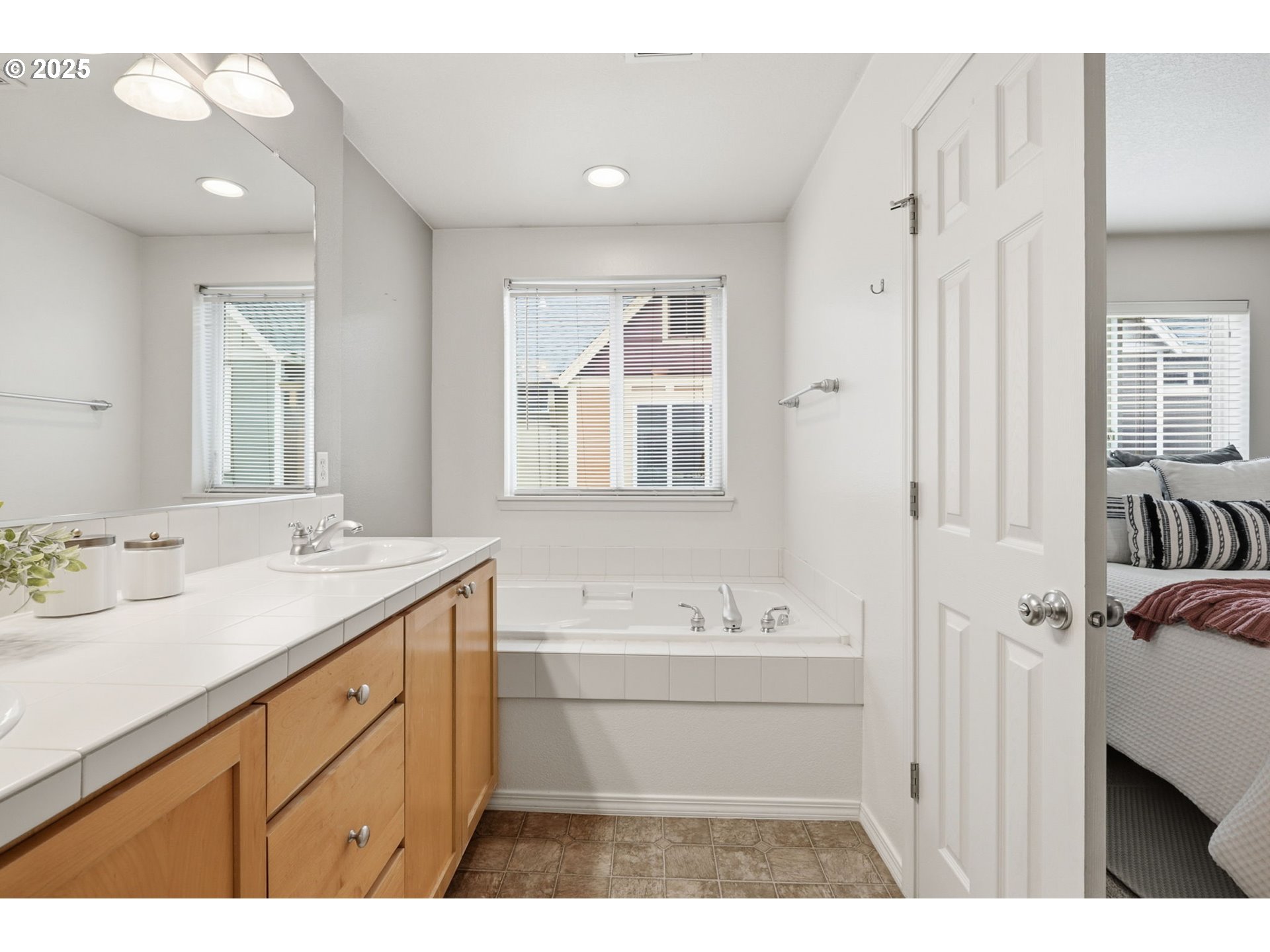 1706 Southwest 172nd Terrace Beaverton, OR 97003 - Photo 22 of 45 a bathroom with a sink a mirror and a bathtub