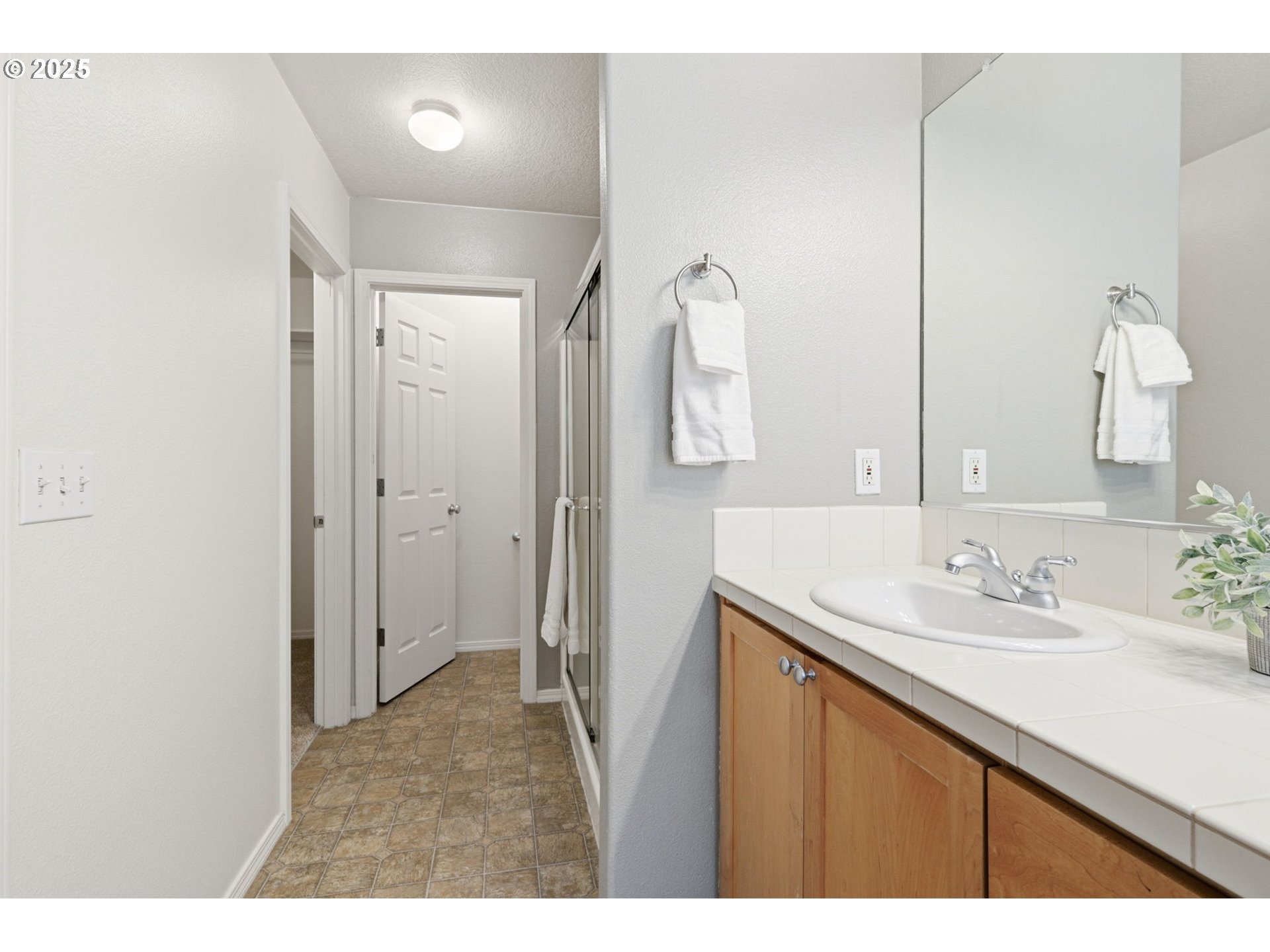 1706 Southwest 172nd Terrace Beaverton, OR 97003 - Photo 23 of 45 a bathroom with a sink vanity and a mirror