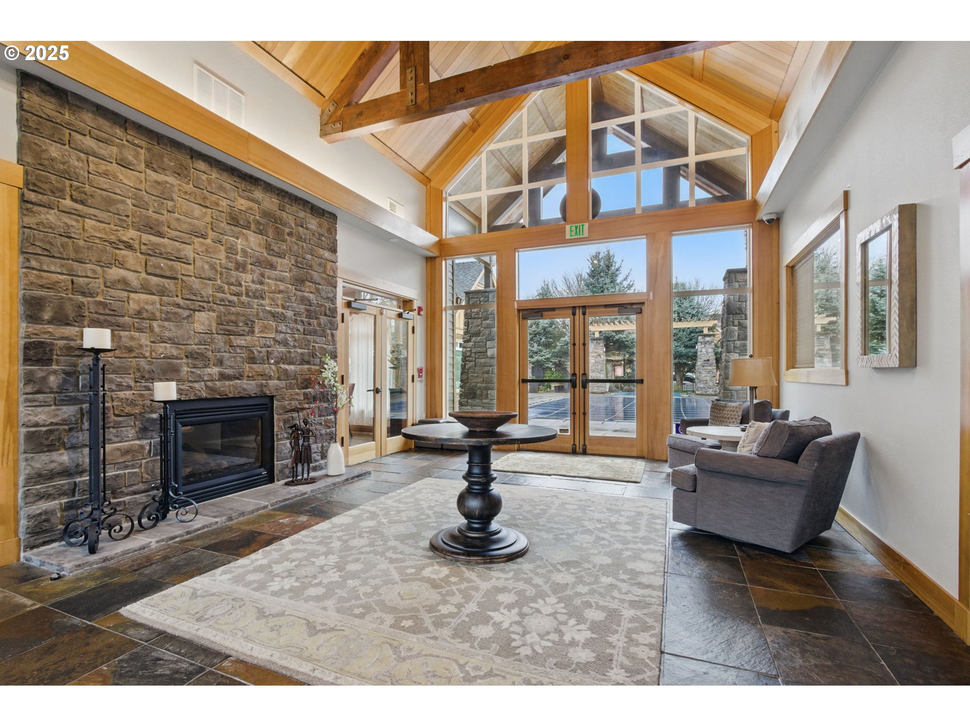 1706 Southwest 172nd Terrace Beaverton, OR 97003 - Photo 40 of 45 a living room with furniture a fireplace and a large window
