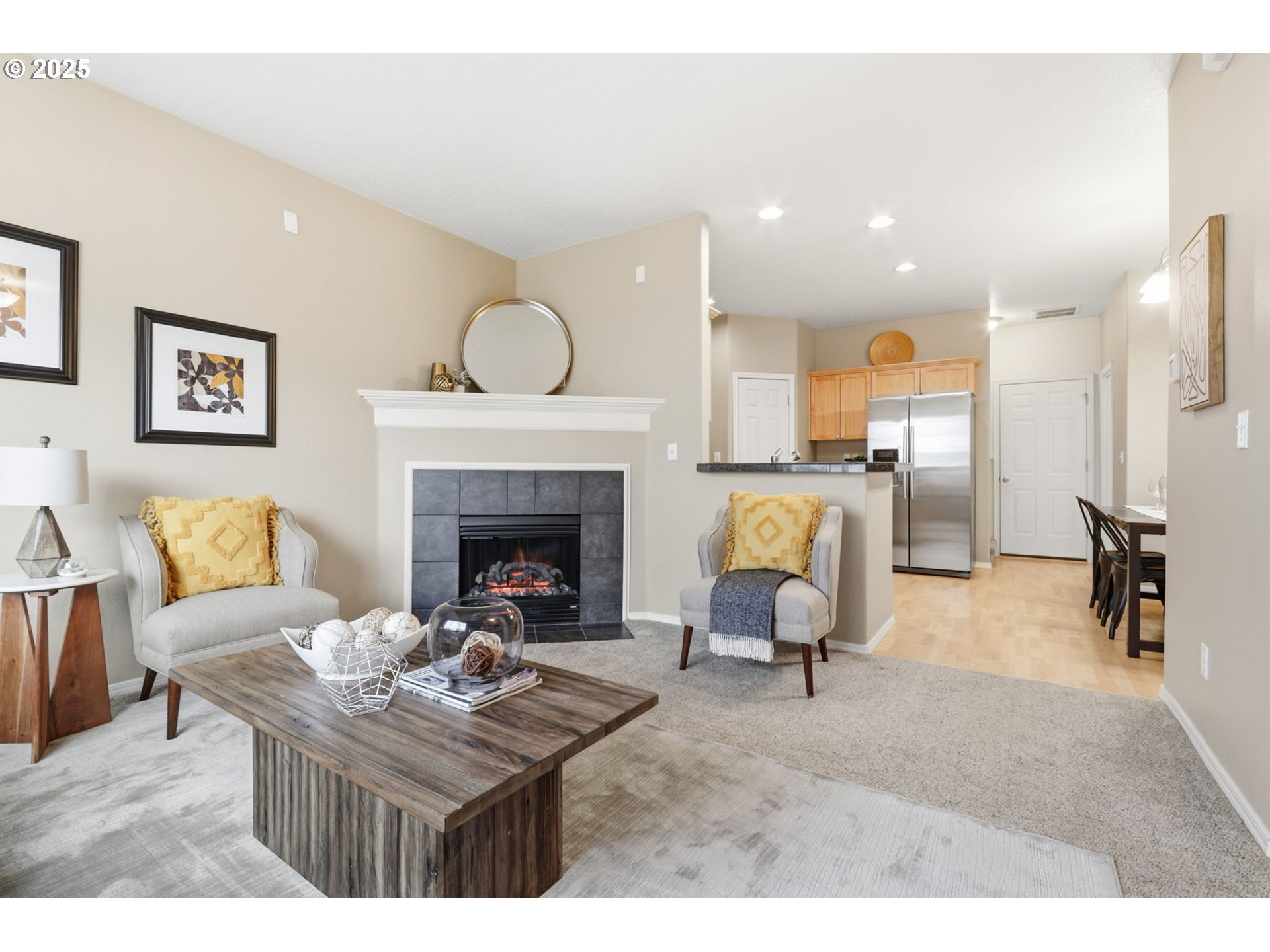 1706 Southwest 172nd Terrace Beaverton, OR 97003 - Photo 6 of 45 a living room with furniture a fireplace and a table