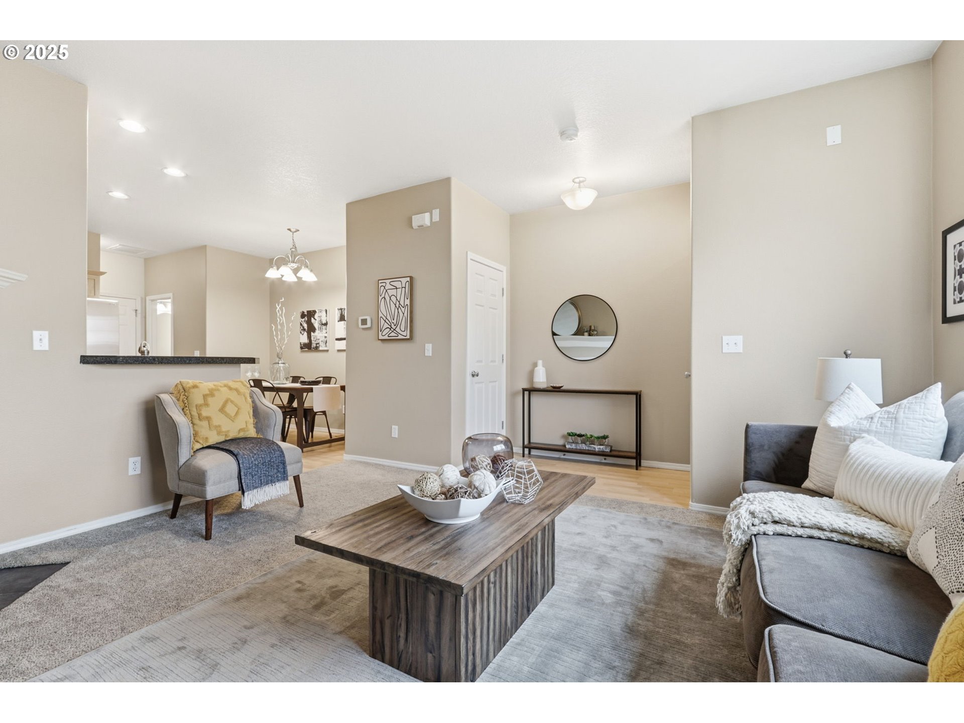 1706 Southwest 172nd Terrace Beaverton, OR 97003 - Photo 8 of 45 a living room with furniture a mirror and a table