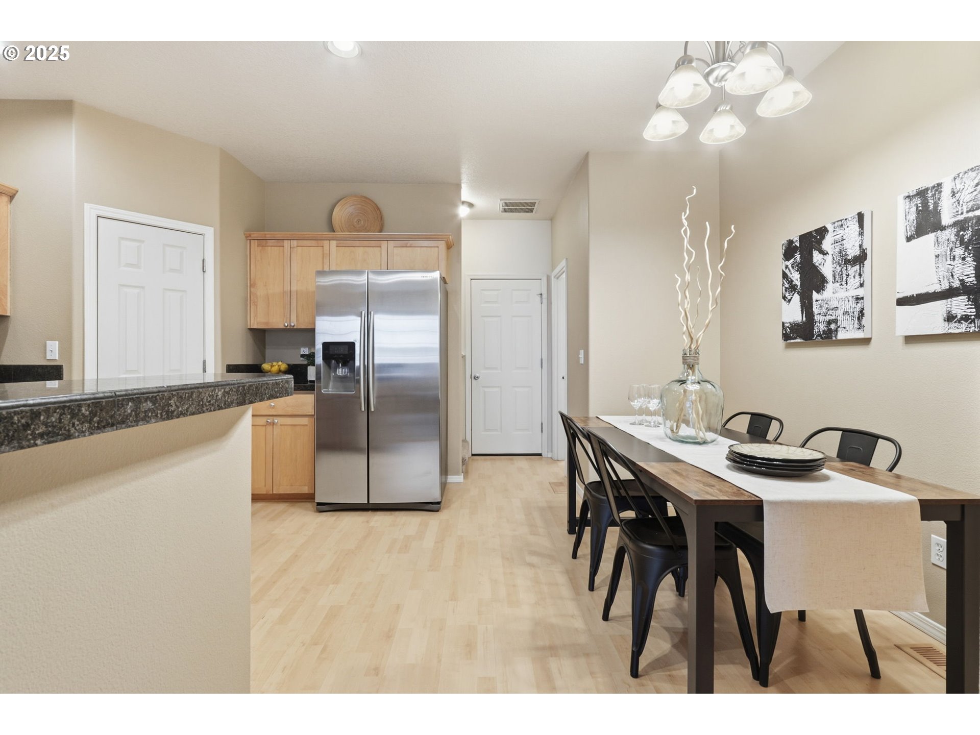 1706 Southwest 172nd Terrace Beaverton, OR 97003 - Photo 9 of 45 a kitchen with kitchen island a counter top space appliances and cabinets