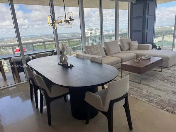 a view of a dining room with furniture window and outside view