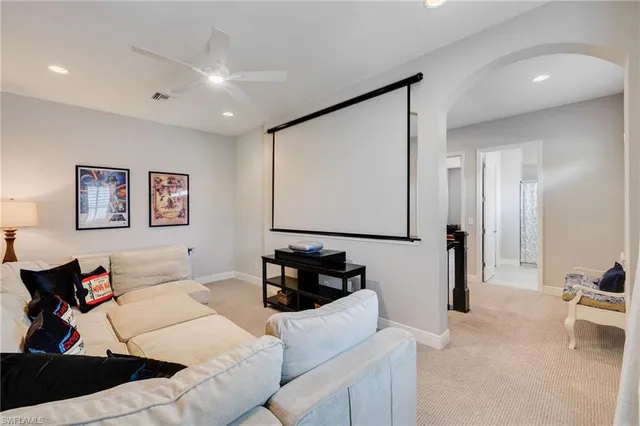 a bedroom with a bed couch and a window