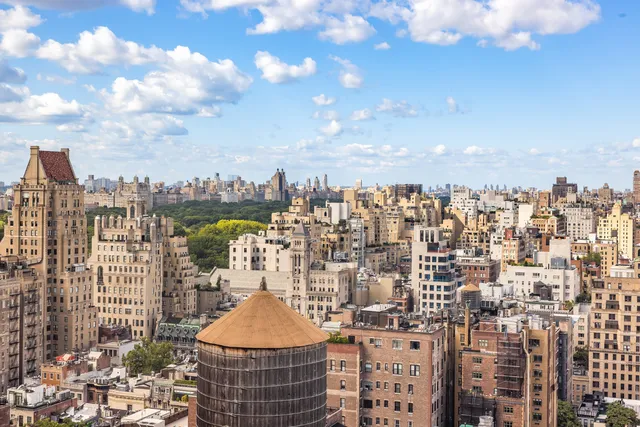 a bathroom with a sink mirror vanity and toilet