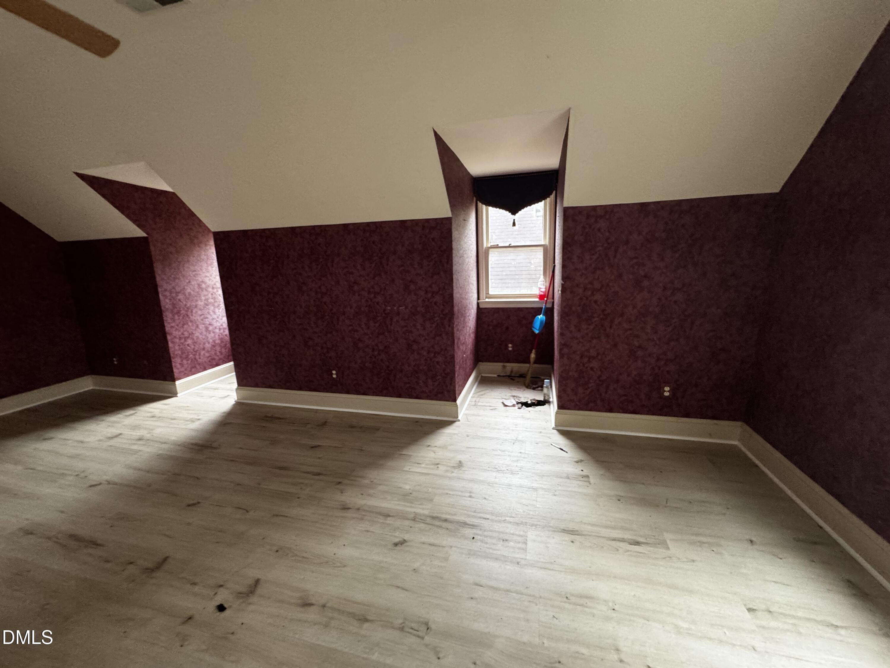 6508 Litchford Road Raleigh, NC 27615 - Photo 14 of 17 a view of an empty room with wooden floor
