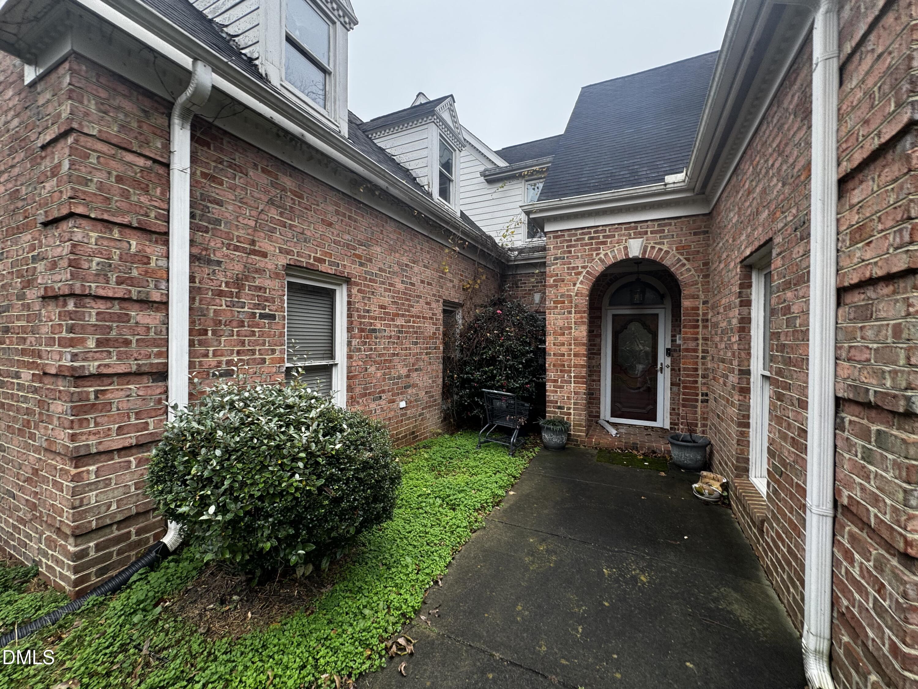 6508 Litchford Road Raleigh, NC 27615 - Photo 2 of 17 a front view of a house with garden