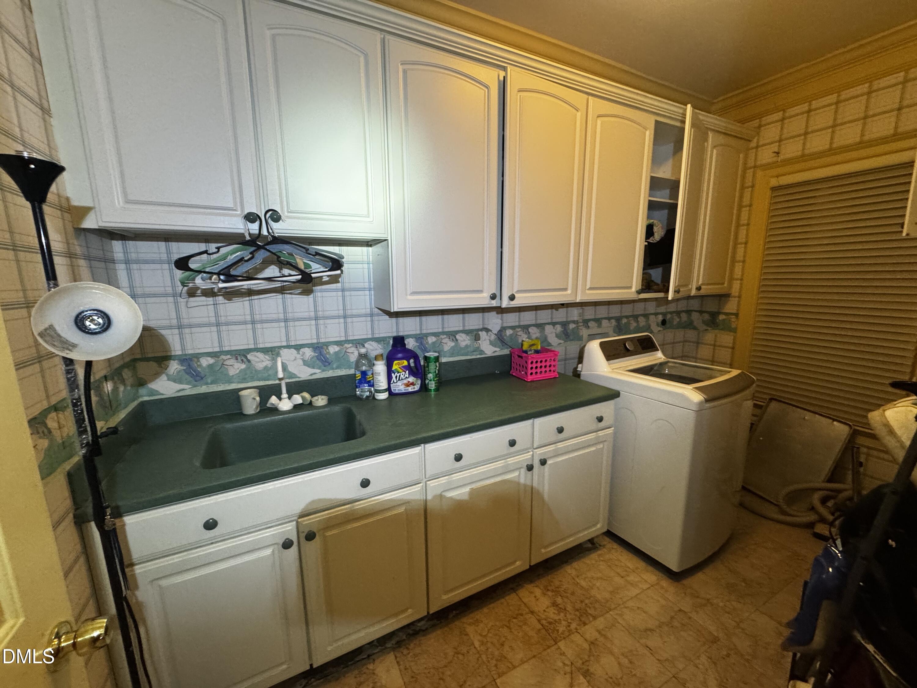 6508 Litchford Road Raleigh, NC 27615 - Photo 6 of 17 a kitchen with sink cabinets and window