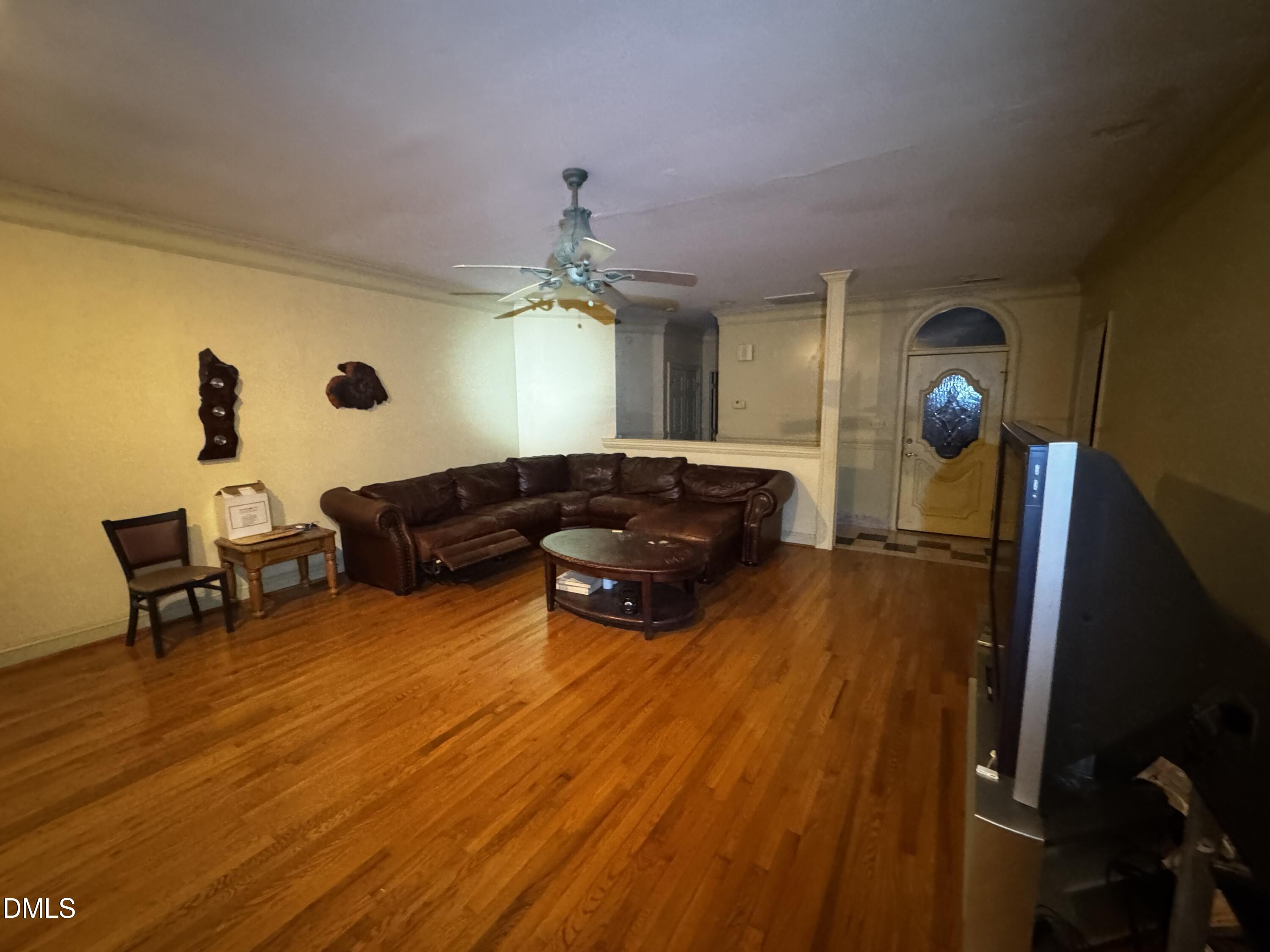 6508 Litchford Road Raleigh, NC 27615 - Photo 7 of 17 a living room with furniture and wooden floor