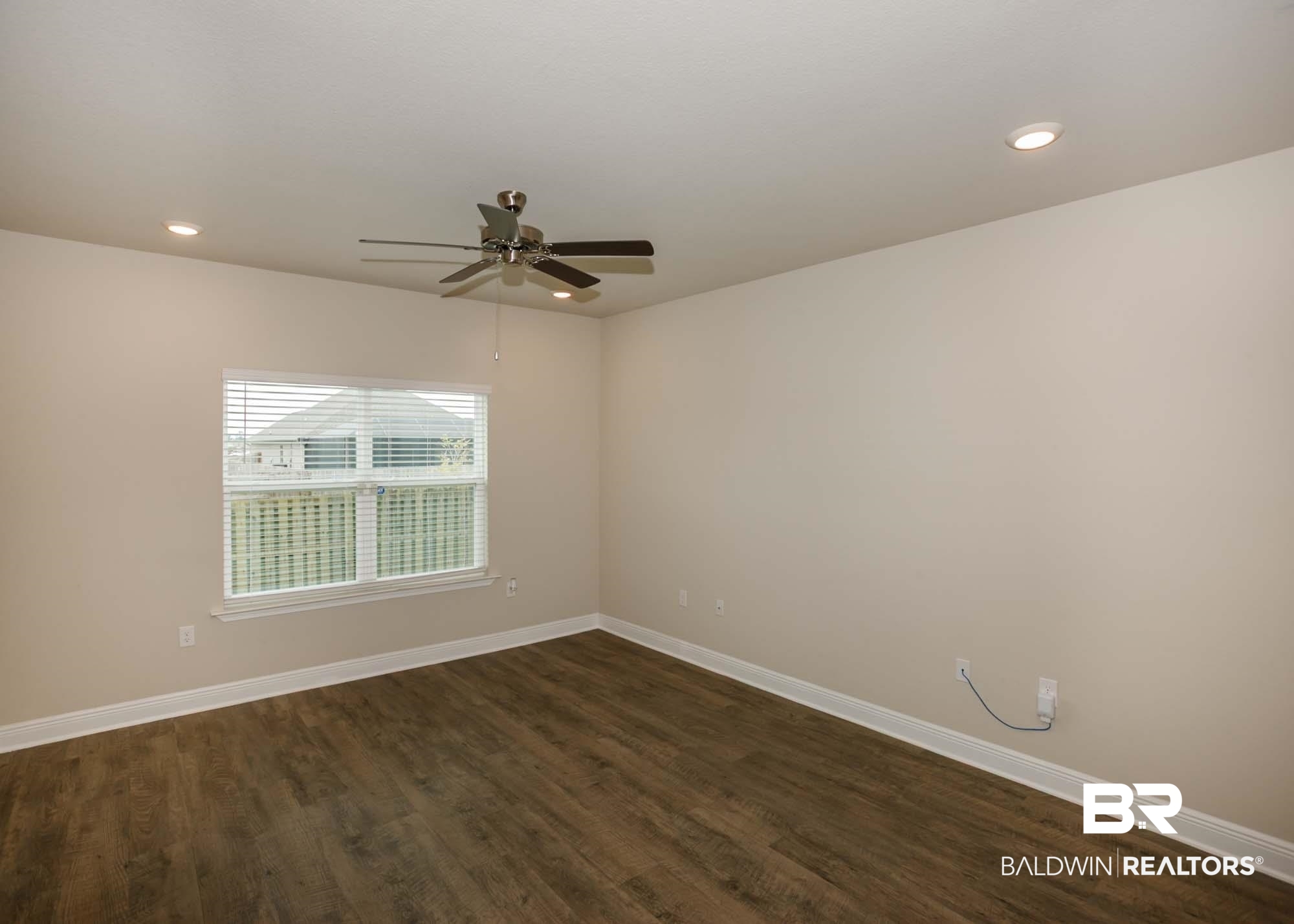 1436 Kairos Loop Foley, AL 36535 - Photo 21 of 52 Empty room with ceiling fan, dark wood-type flooring, and recessed lighting