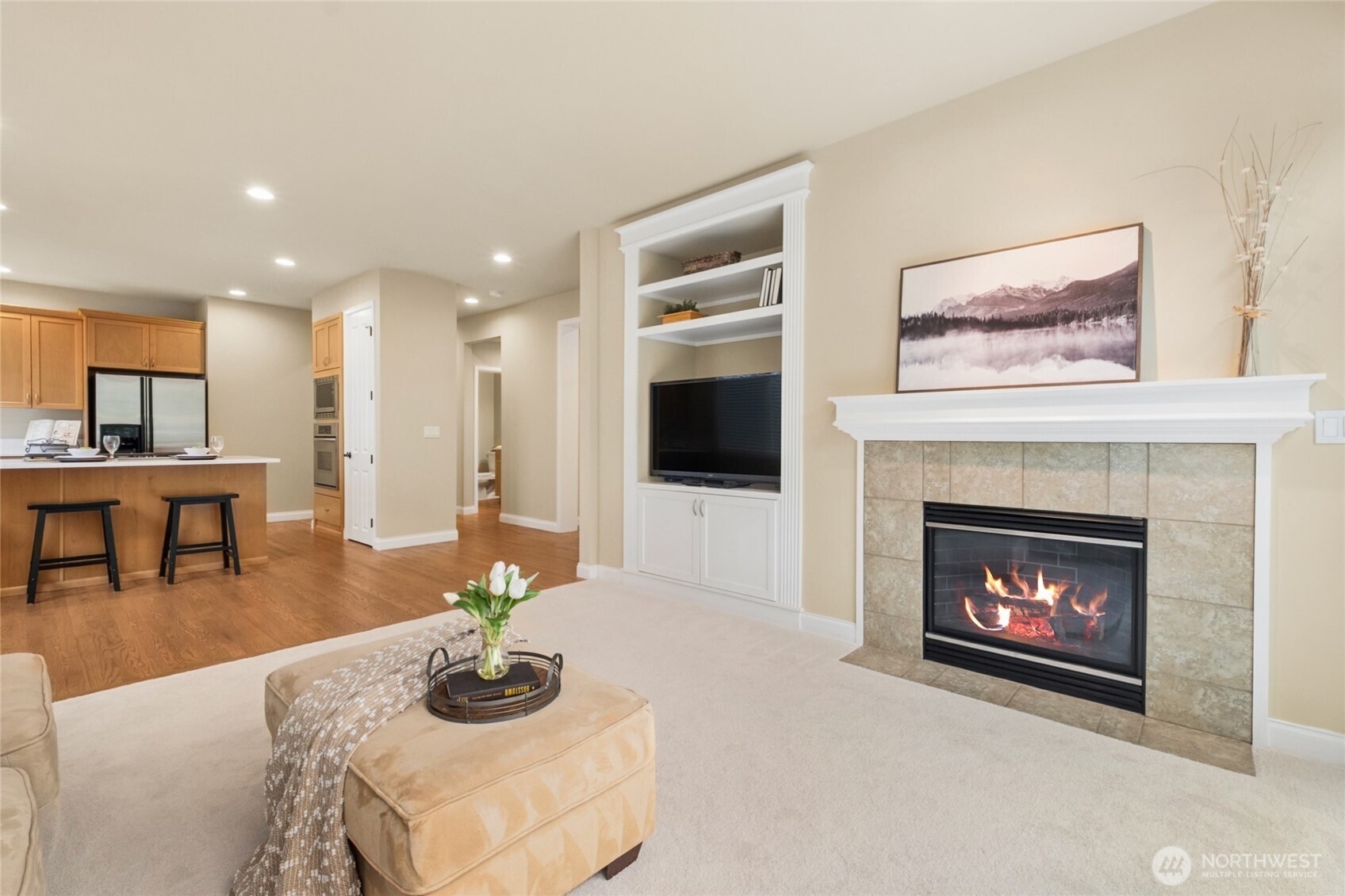 6701 West Crestview Loop Southeast Snoqualmie, WA 98065 - Photo 11 of 40 a living room with furniture and a fireplace