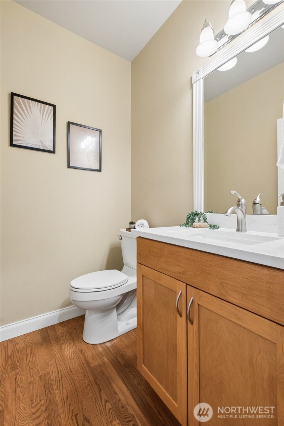 6701 West Crestview Loop Southeast Snoqualmie, WA 98065 - Photo 17 of 40 a bathroom with a toilet a sink and mirror