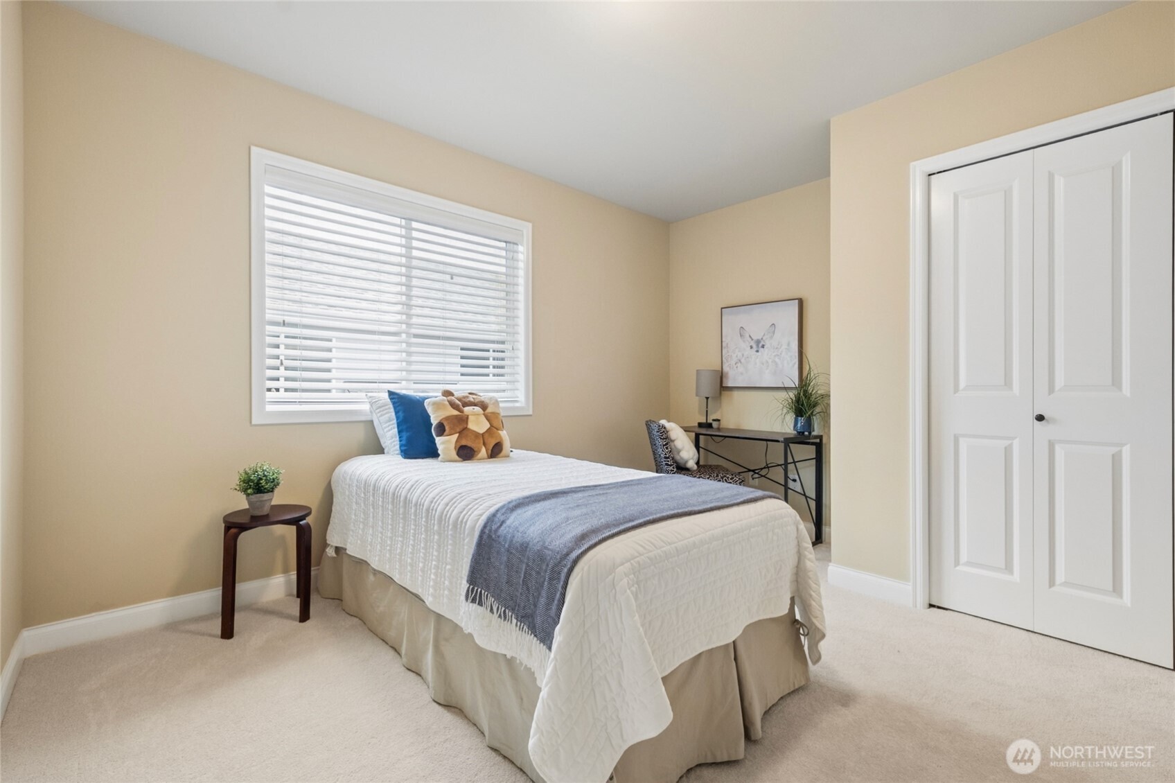 6701 West Crestview Loop Southeast Snoqualmie, WA 98065 - Photo 23 of 40 a bedroom with a bed and a window