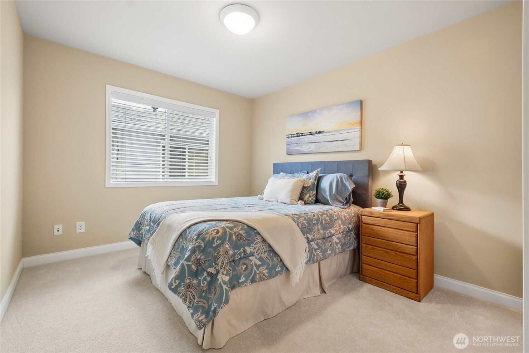 6701 West Crestview Loop Southeast Snoqualmie, WA 98065 - Photo 24 of 40 a bedroom with a bed and a night stand