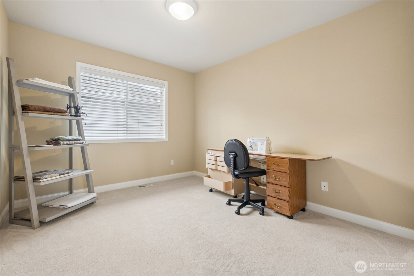 6701 West Crestview Loop Southeast Snoqualmie, WA 98065 - Photo 26 of 40 a view of a workspace with furniture and a window