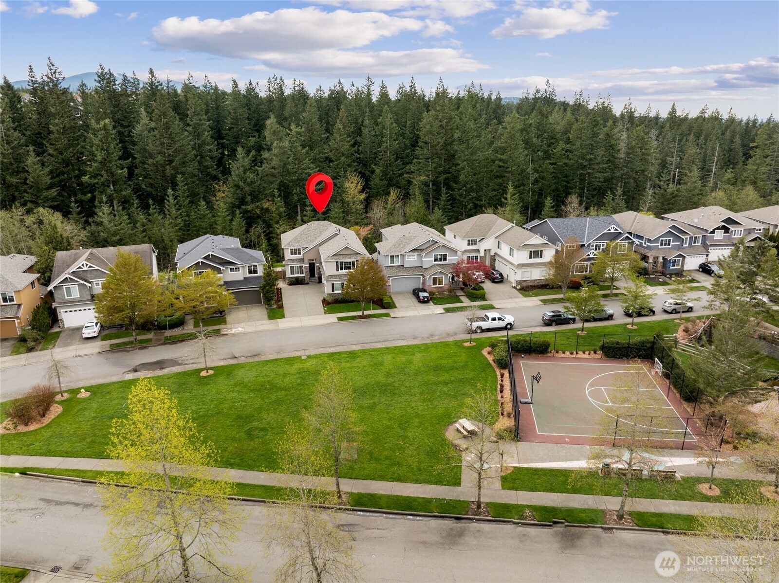 6701 West Crestview Loop Southeast Snoqualmie, WA 98065 - Photo 37 of 40 a front view of a house with swimming pool and trees