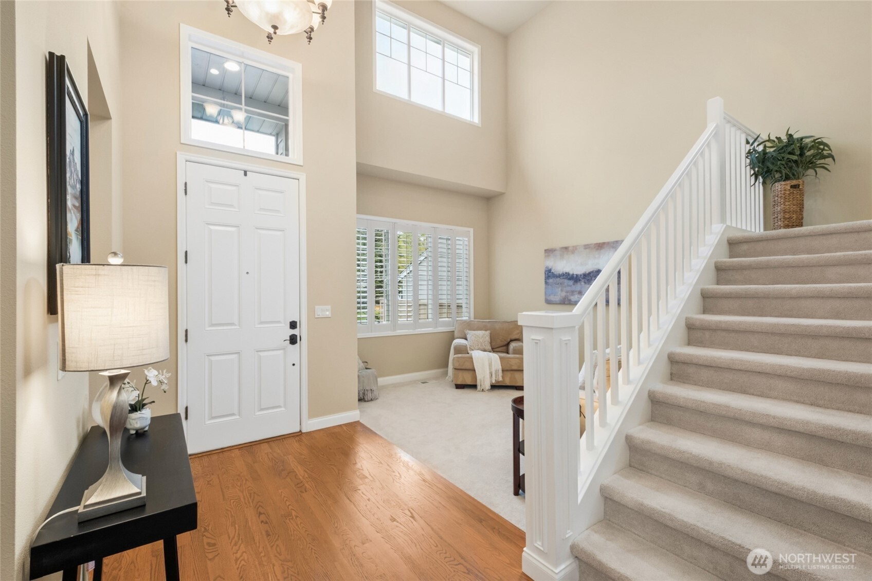 6701 West Crestview Loop Southeast Snoqualmie, WA 98065 - Photo 4 of 40 a view of an entryway with wooden floor and a cabinet