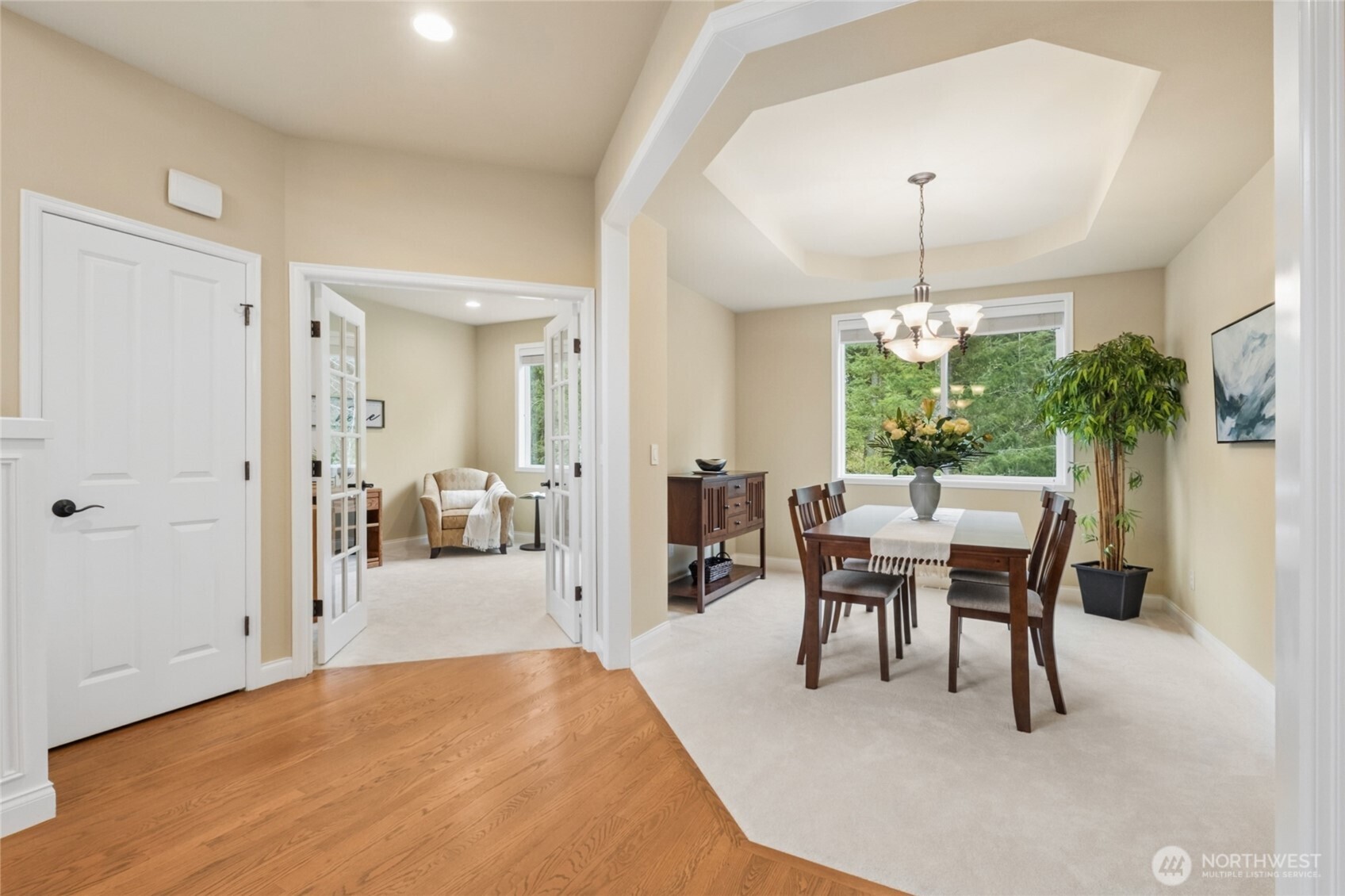 6701 West Crestview Loop Southeast Snoqualmie, WA 98065 - Photo 7 of 40 a view of a dining room with furniture and a chandelier