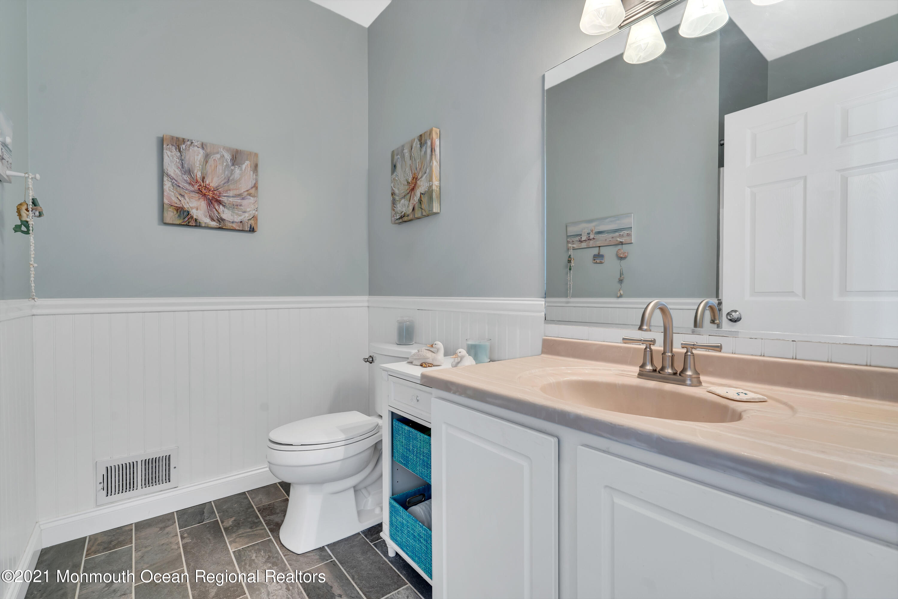 6 Pilot Road Toms River, NJ 08753 - Photo 20 of 35 a bathroom with a sink a toilet a mirror and vanity