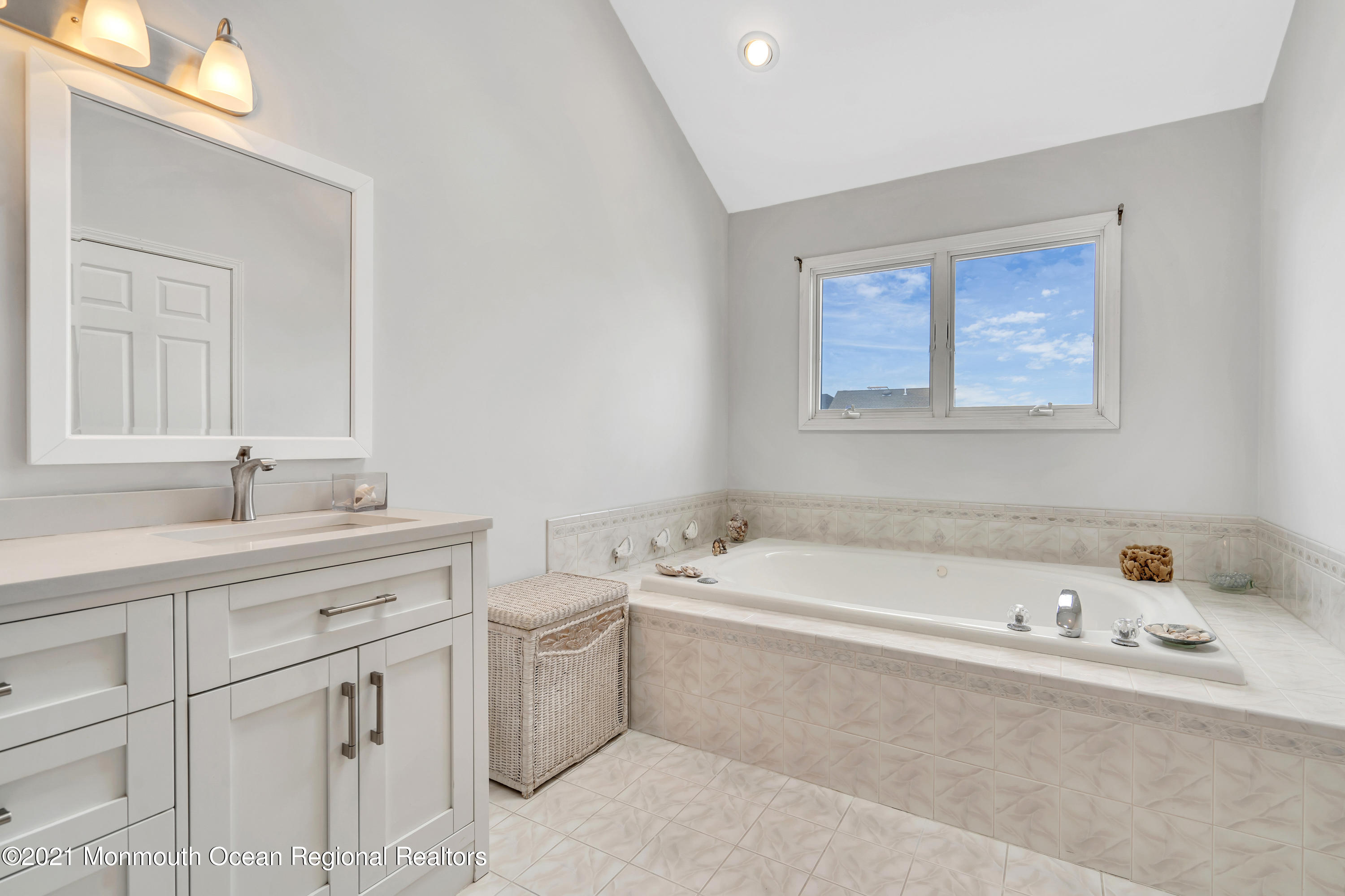 6 Pilot Road Toms River, NJ 08753 - Photo 29 of 35 a bathroom with a tub sink and mirror
