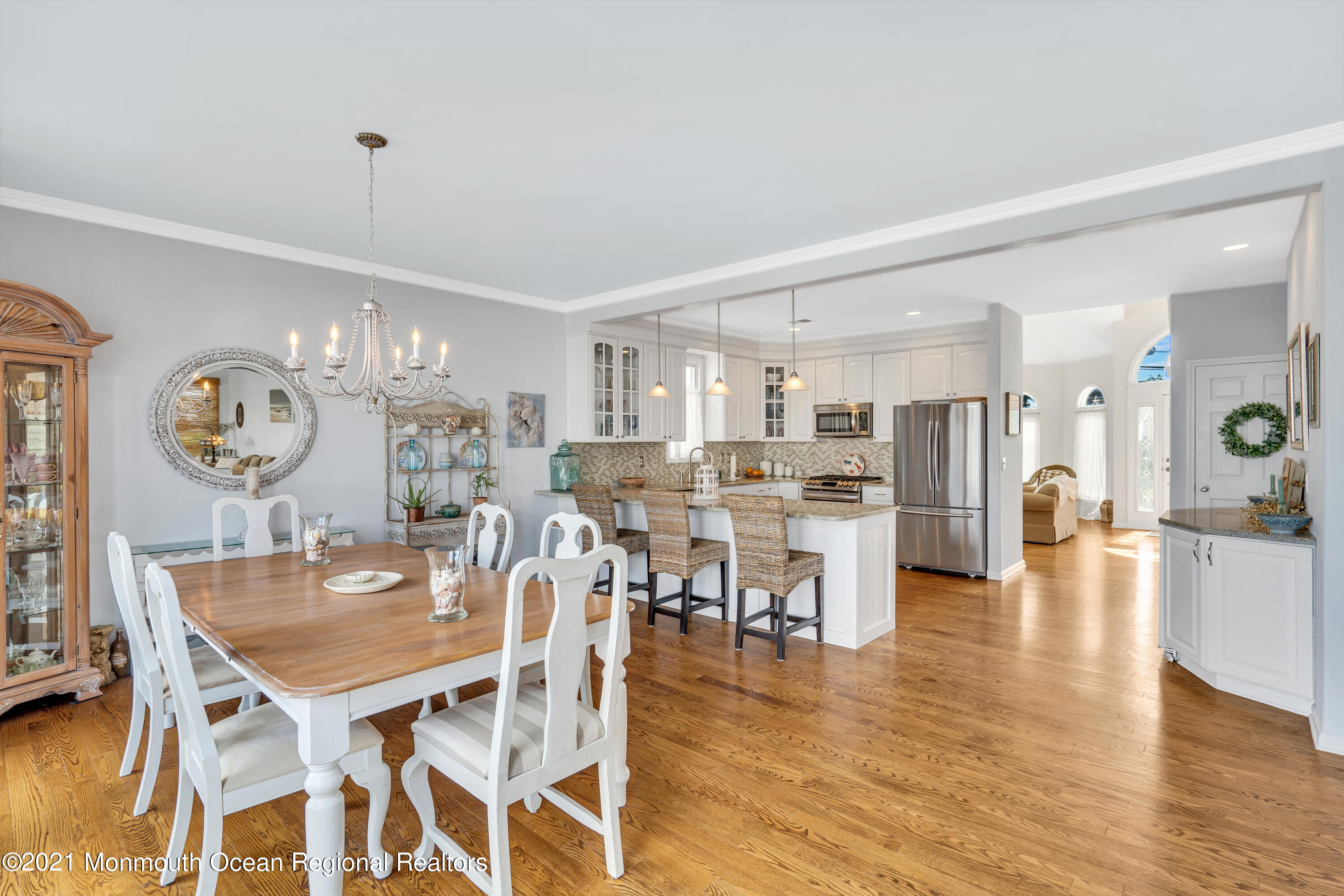 6 Pilot Road Toms River, NJ 08753 - Photo 10 of 35 a view of a dining room and livingroom with furniture wooden floor a chandelier