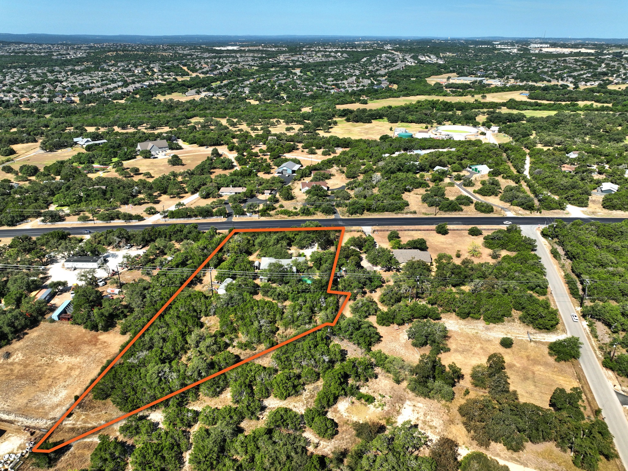 13107 Nutty Brown Road Austin, TX 78737 - Photo 3 of 8 Mature trees and open space define this sprawling acreage lot outlined in orange.