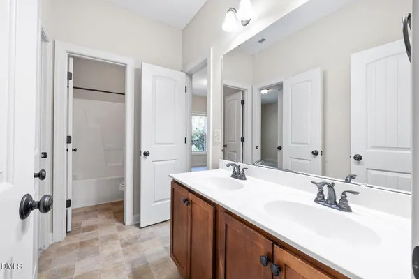 a bathroom with a shower and a toilet