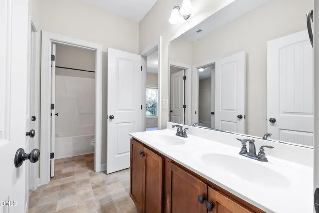 a bathroom with a shower and a toilet