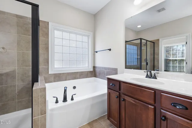 a bathroom with a glass shower door