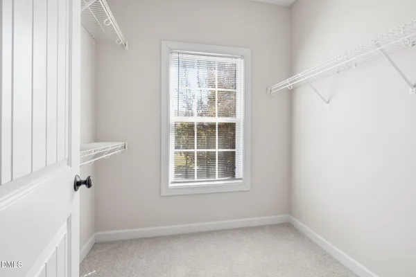 a view of a room with wooden floor and outdoor space