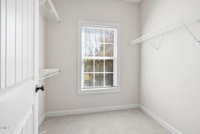 a view of a room with wooden floor and outdoor space