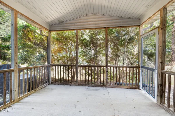 a view of a porch with wooden floor and outdoor space