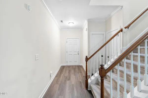 a view of entryway with wooden floor