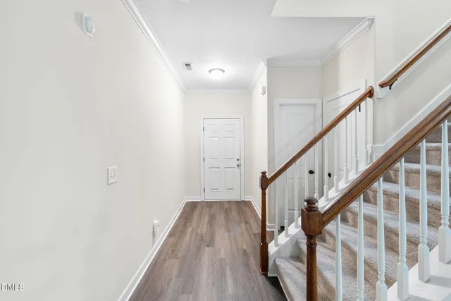 a view of entryway with wooden floor