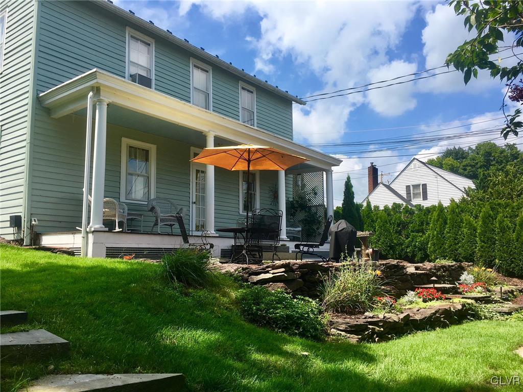 684 Church Road Riegelsville, PA 18077 - Photo 14 of 37 a view of a patio with table and chairs under an umbrella