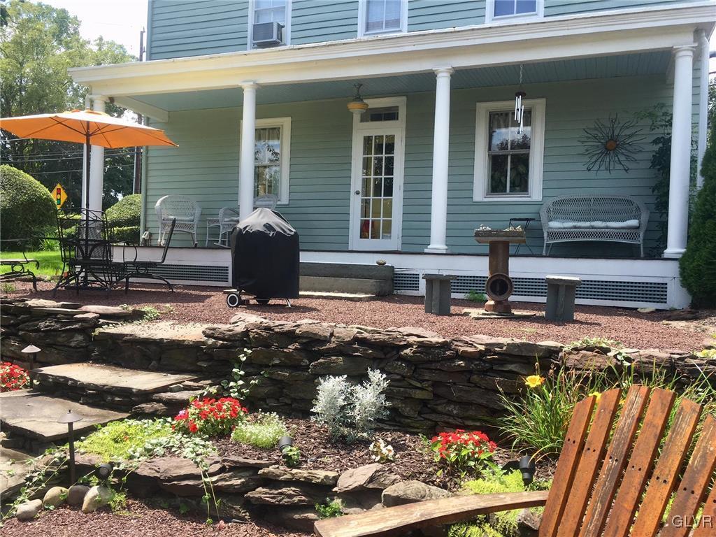 684 Church Road Riegelsville, PA 18077 - Photo 15 of 37 a front view of a house with a yard and a fire pit