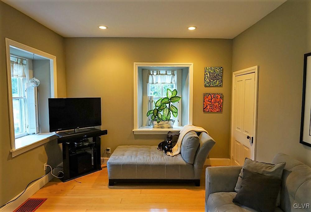 684 Church Road Riegelsville, PA 18077 - Photo 18 of 37 a living room with furniture and a flat screen tv