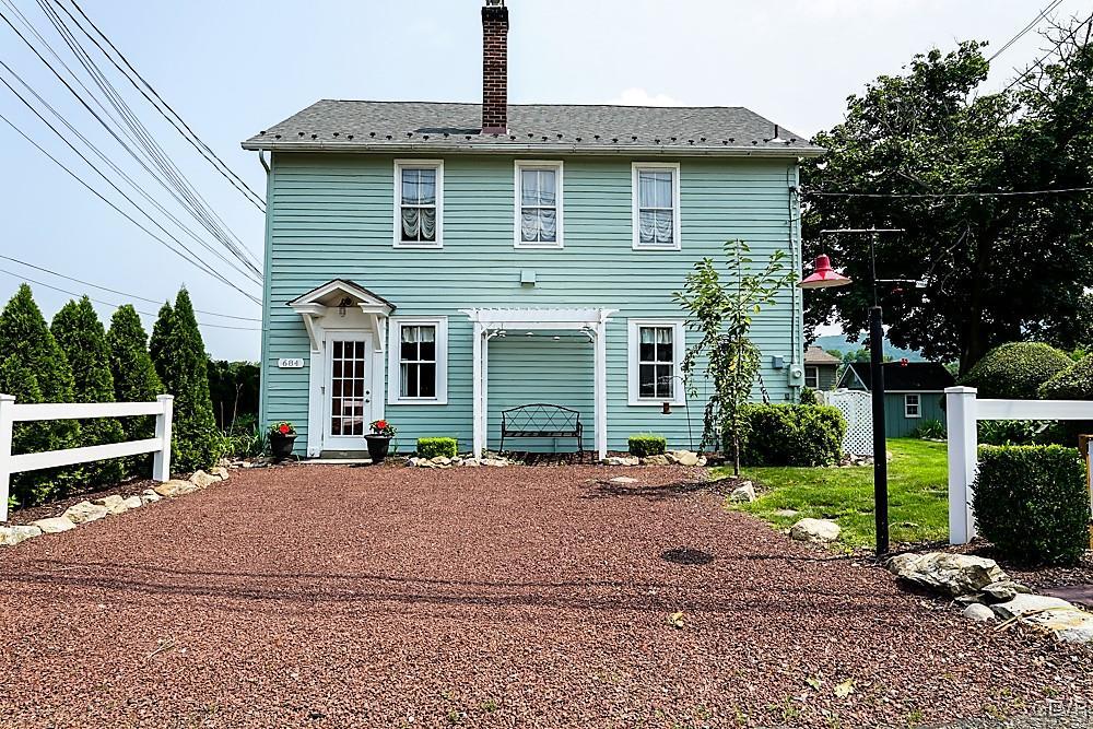 684 Church Road Riegelsville, PA 18077 - Photo 2 of 37 a front view of a house with a yard and potted plants