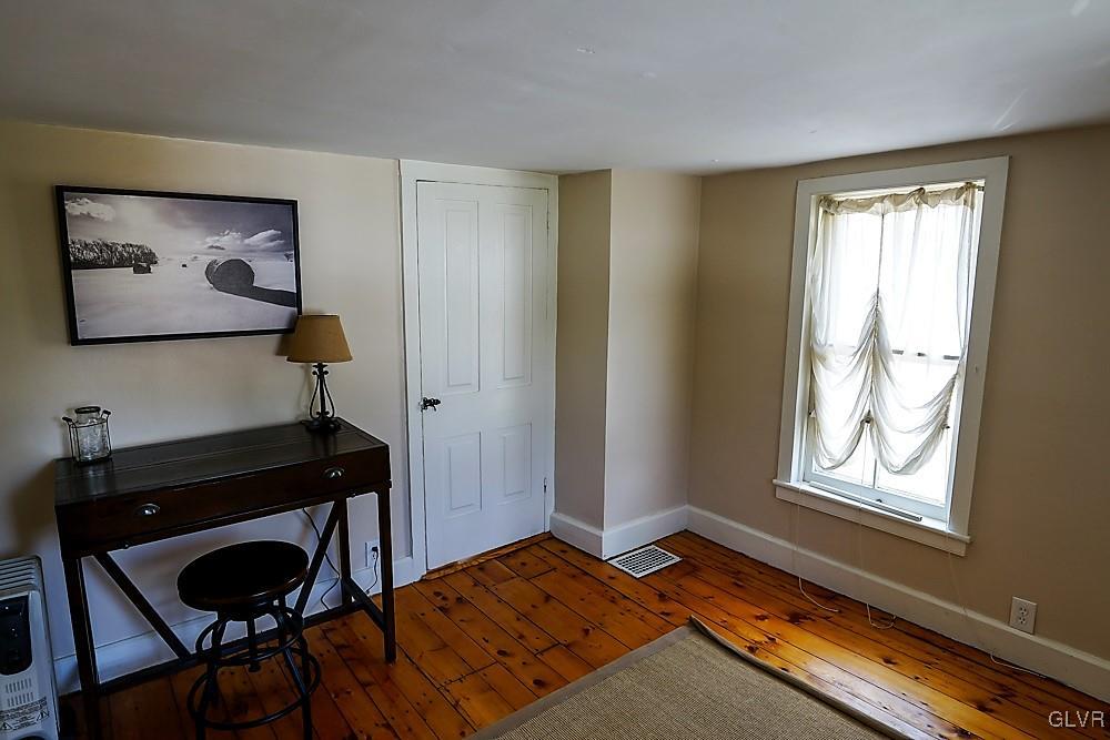 684 Church Road Riegelsville, PA 18077 - Photo 29 of 37 a bedroom with a bed and a window