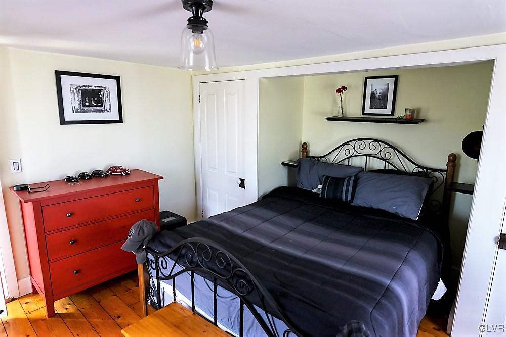 684 Church Road Riegelsville, PA 18077 - Photo 33 of 37 a bedroom with a bed and a dresser