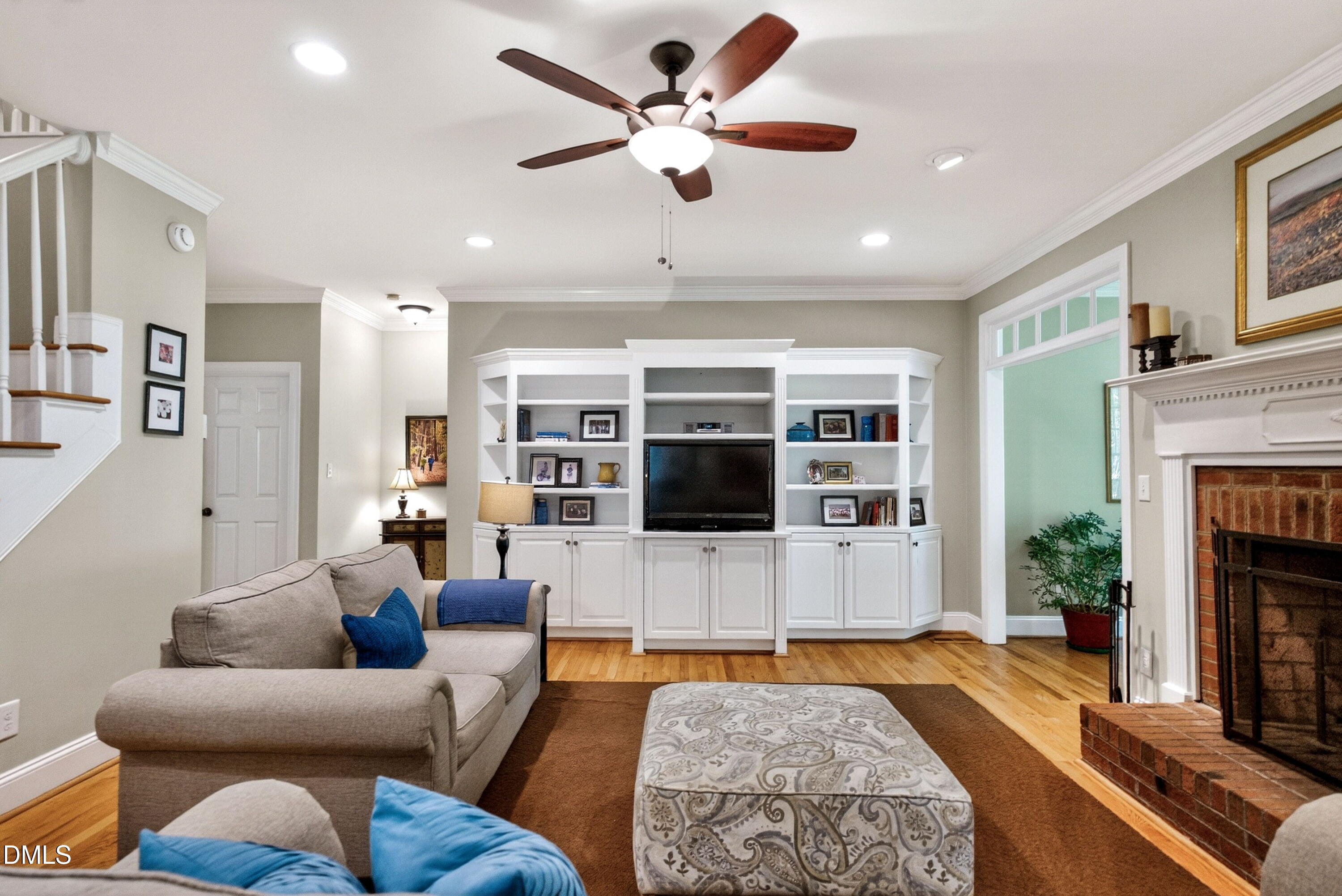 6329 Battleview Drive Raleigh, NC 27613 - Photo 11 of 36 a living room with furniture and a fireplace with wooden floor