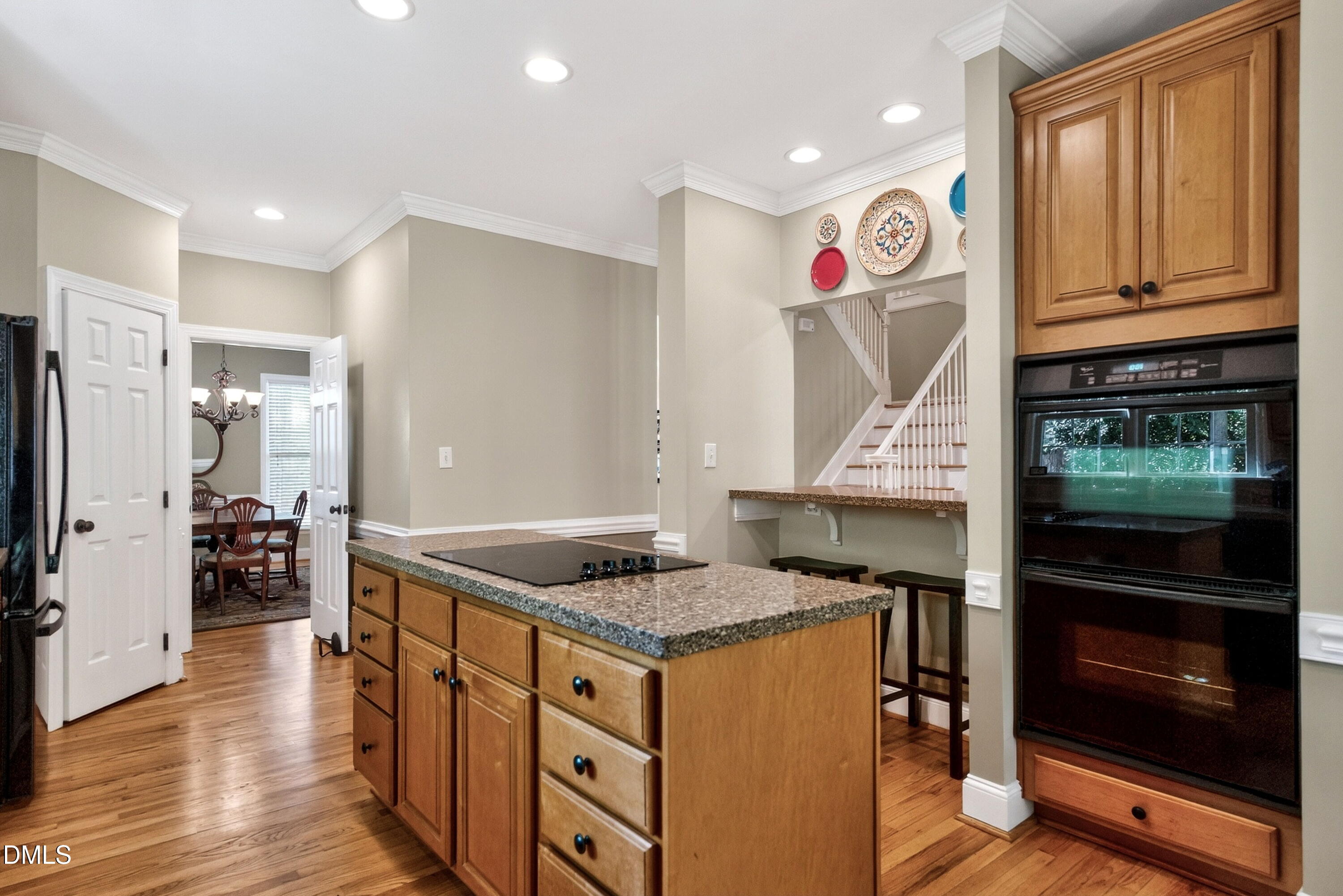 6329 Battleview Drive Raleigh, NC 27613 - Photo 16 of 36 a kitchen with granite countertop a stove and a refrigerator
