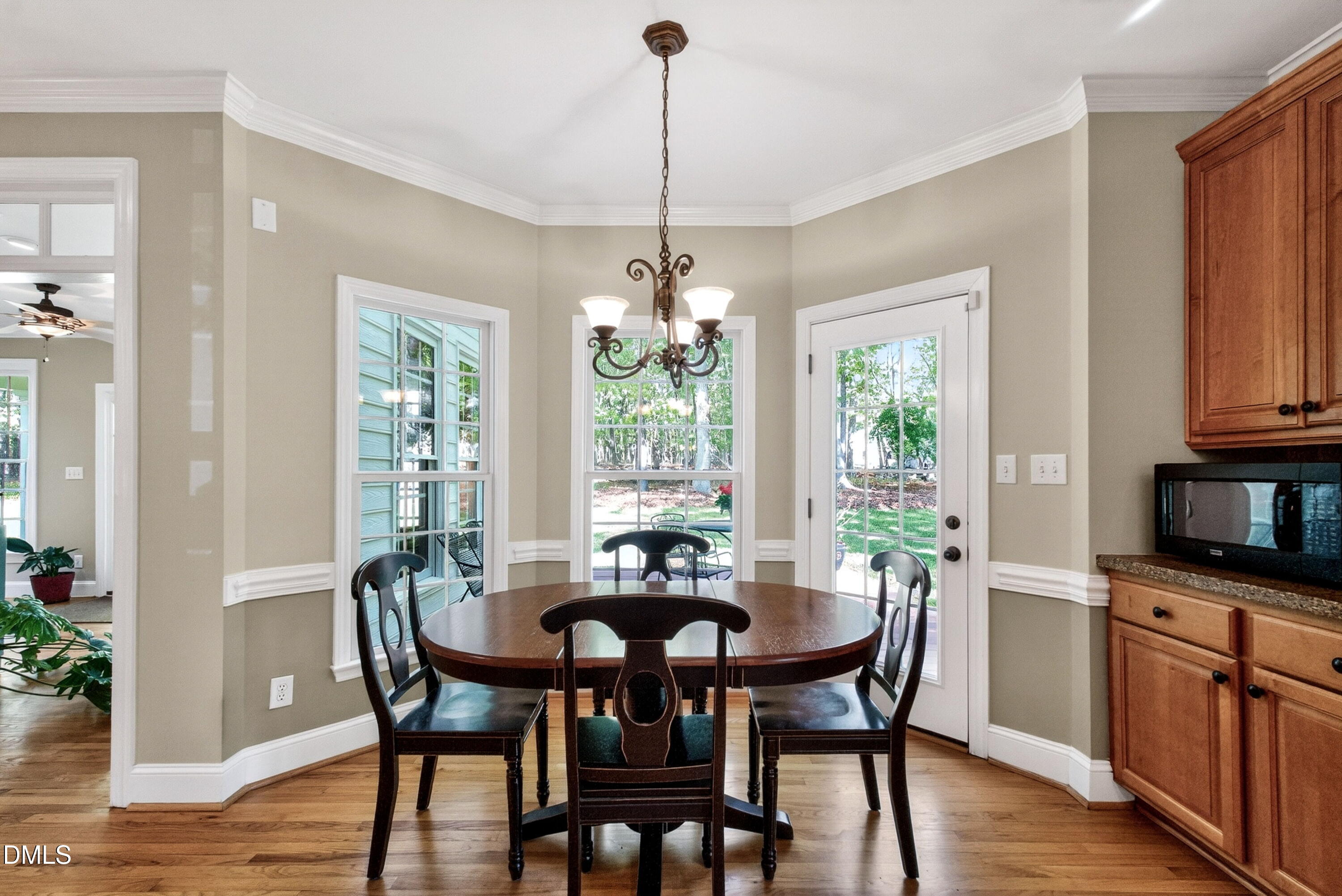 6329 Battleview Drive Raleigh, NC 27613 - Photo 17 of 36 a dining room with furniture window and wooden floor